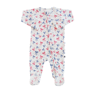 Baby onesie with red and blue bow pattern on a white background