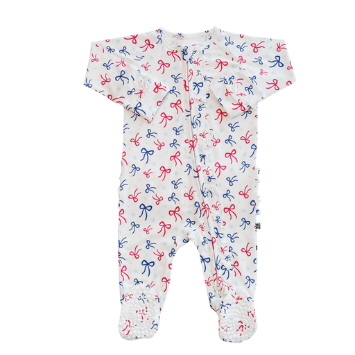 Baby onesie with red and blue bow pattern on a white background