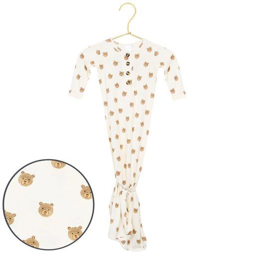Baby onesie with bear pattern on a hanger against a white background