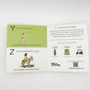 An open children's prayer booklet or devotional card laid on a light gray background. The left page has a pale green header with the letter Y and text about Young David, plus a small illustration.