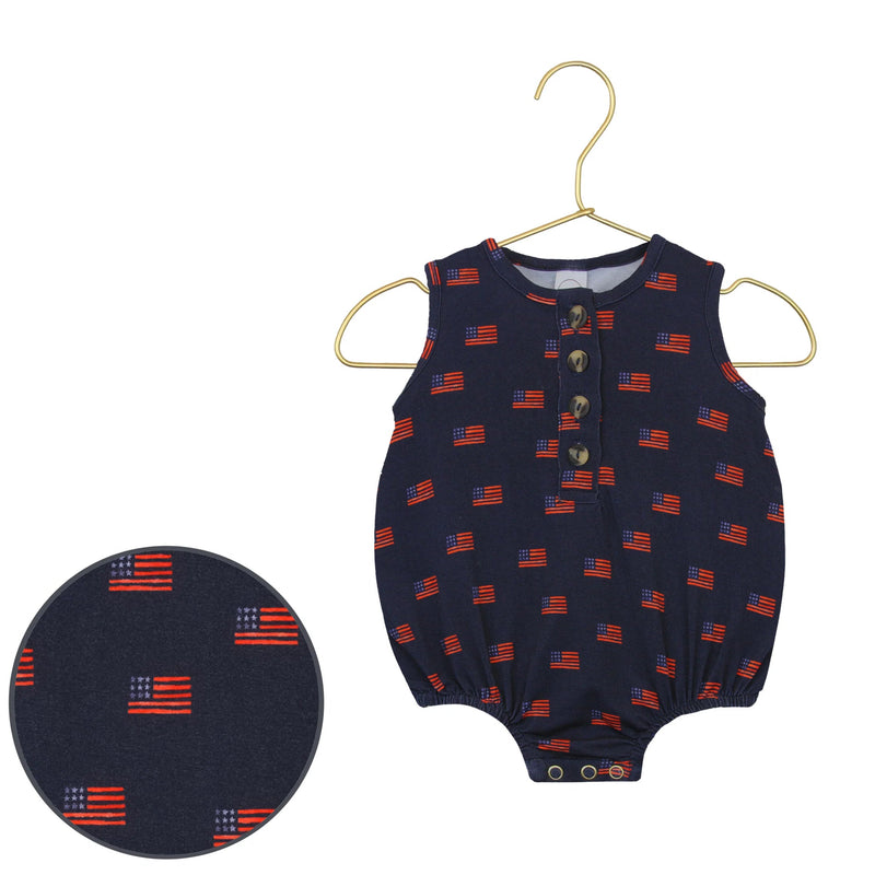 Navy baby romper on a hanger with close-up of fabric texture.