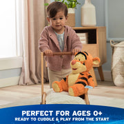 Child playing on the floor with Oh So Snuggly Tigger plush