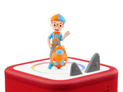 Blippi Tonie on a red Toniebox next to the gray ears, close-up