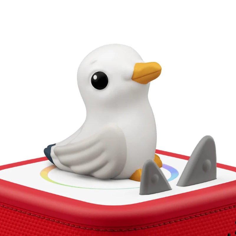 Seagull-shaped toy on a red base with a white background