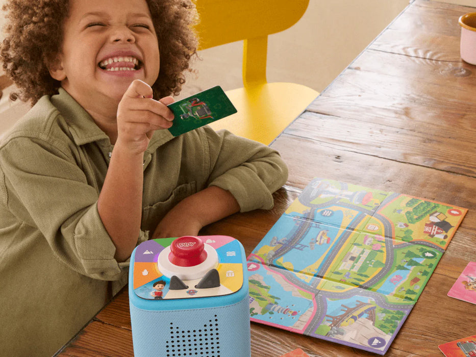 Child playing a PAW Patrol Tonieplay game on Toniebox 2 with the red controller