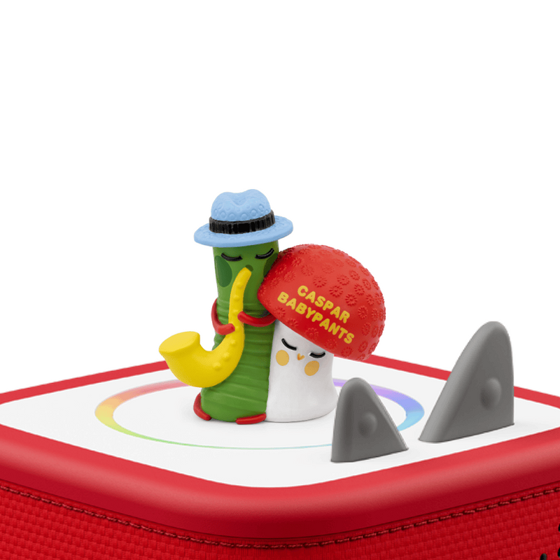 Toy figure with a red ball and a shark fin on a white background