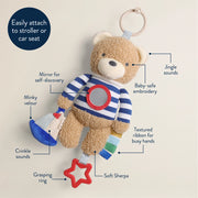 Product feature diagram highlighting the sensory elements of the Bitzy Traveler toy