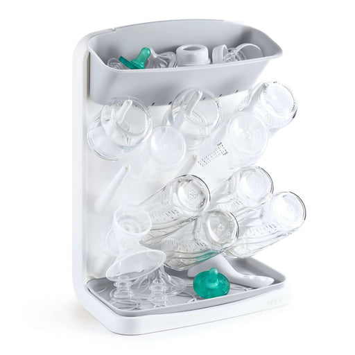 Ubbi Vertical Bottle Drying Rack holding baby bottles, nipples and pacifiers