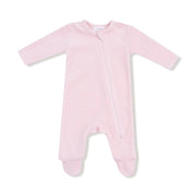 Pink velour footie with long sleeves and a diagonal zipper shown flat on a white background.