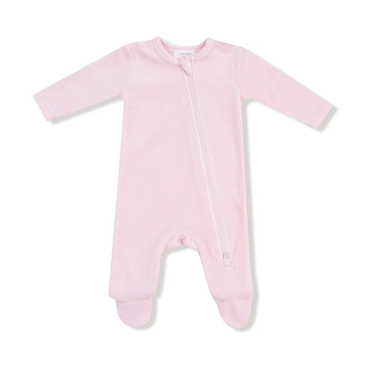 Pink velour footie with long sleeves and a diagonal zipper shown flat on a white background.