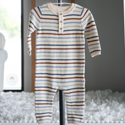 Sweater knit Striped baby romper on a hanger against a neutral background