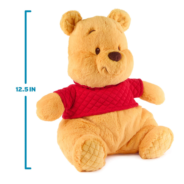 Winnie the Pooh plush with height marker showing 12.5 inches