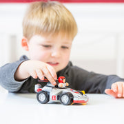 Toddler playing with WOW Toys Richie Race Car