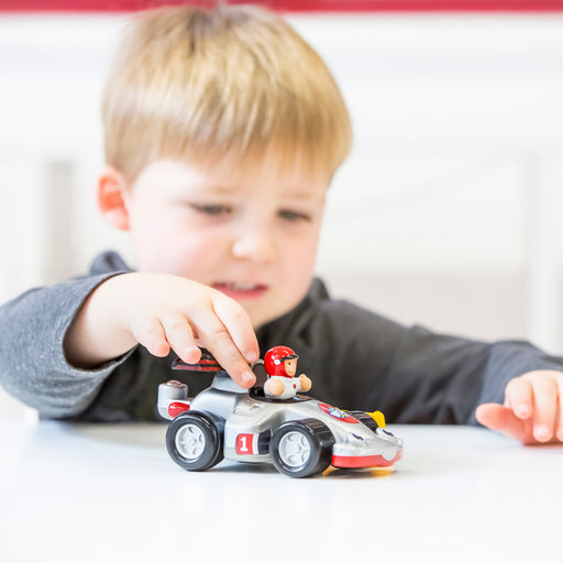 Toddler playing with WOW Toys Richie Race Car
