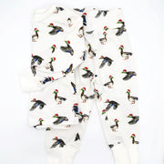 Flatlay of Saltwater Swaddles Duck the Halls kids pajamas with watercolor ducks wearing Santa hats on white background