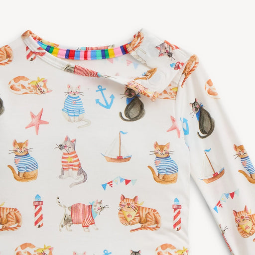 Fabric with cat-themed design featuring colorful anchors, boats, and striped cats on a white background.