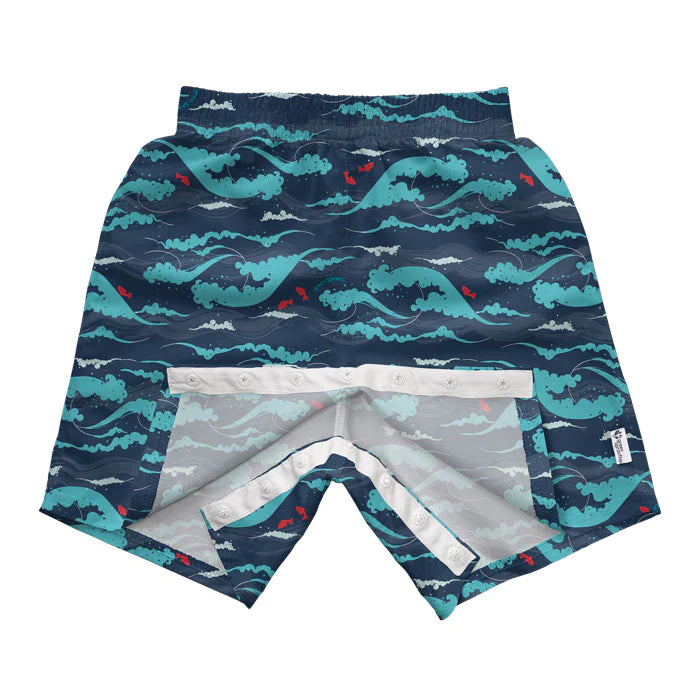  Swim trunks with a navy tidal waves pattern, designed for big kids.