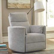 Brixy Radius PLUS power swivel glider recliner in Mineral Grey beside a floor lamp