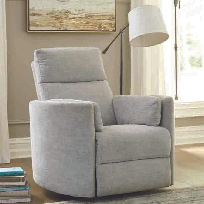 Brixy Radius PLUS power swivel glider recliner in Mineral Grey beside a floor lamp